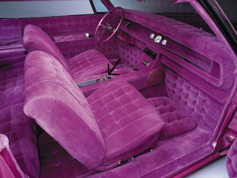 1991 Ford Bronco - Custom purple velvet interior covers the seats, dashboard, and floor of this car.