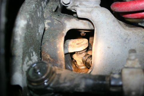 2003 Jeep TJ - Detail view of the front suspension system, showing various mechanical parts.