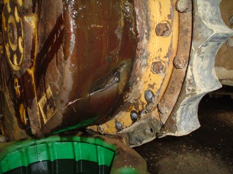 1966 International School Bus - Heavy machinery differential showing signs of wear and fluid leakage.