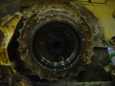 1966 International School Bus - A close-up view of a heavily used drive sprocket, likely from construction equipment, showing wear and tear.