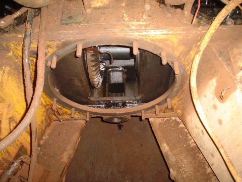 1966 International School Bus - Close-up view of internal gears within a heavily rusted mechanical assembly.