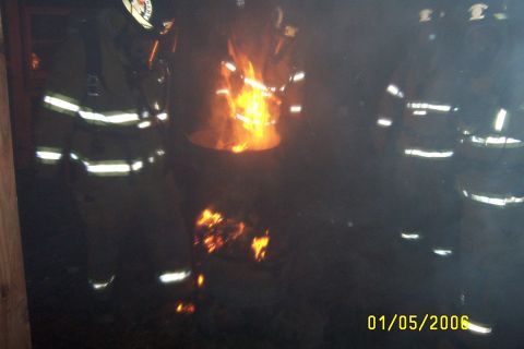 1998 Ford Crown Victoria - Firefighters are visible around a large fire, with a date stamp of January 5, 2006.