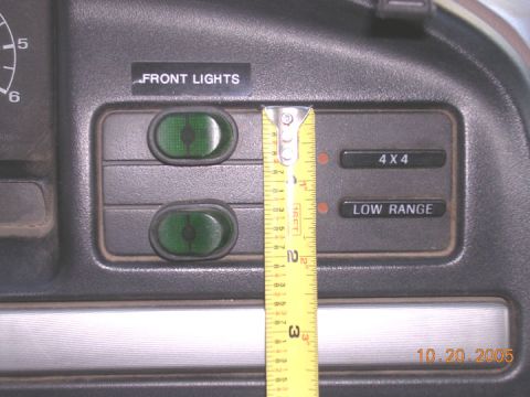 1994 Ford Bronco - Dashboard switch panel detail with a tape measure and date stamp.