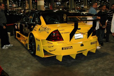 1991 Ford Taurus - This heavily modified sedan features extensive bodywork and racing decals, including 'SONY FIVE HUNDRED'.