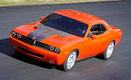 1968 Chevrolet Camaro - This orange Dodge Challenger features a distinctive black stripe design on its hood.