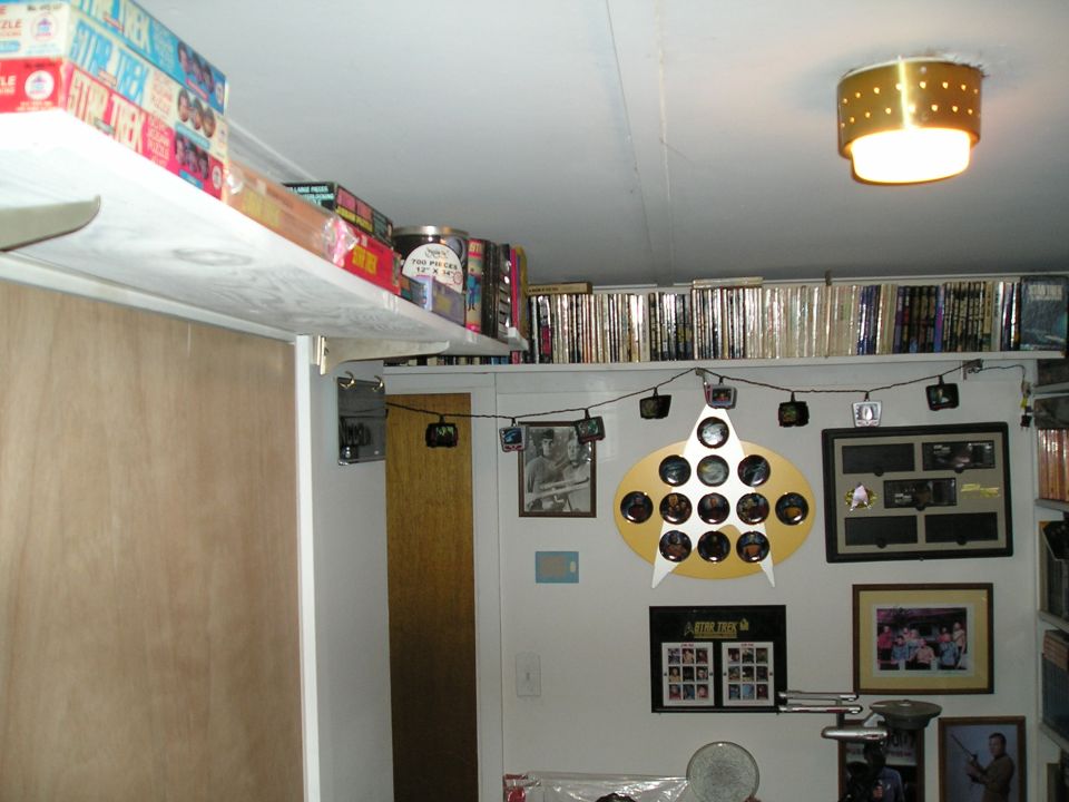 Upper shelves with puzzles and books