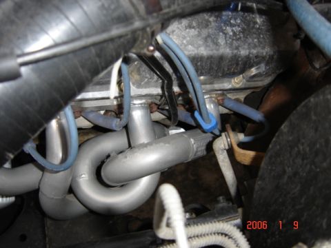 1990 Ford Bronco - Engine exhaust manifold and spark plug wires visible in the engine bay.