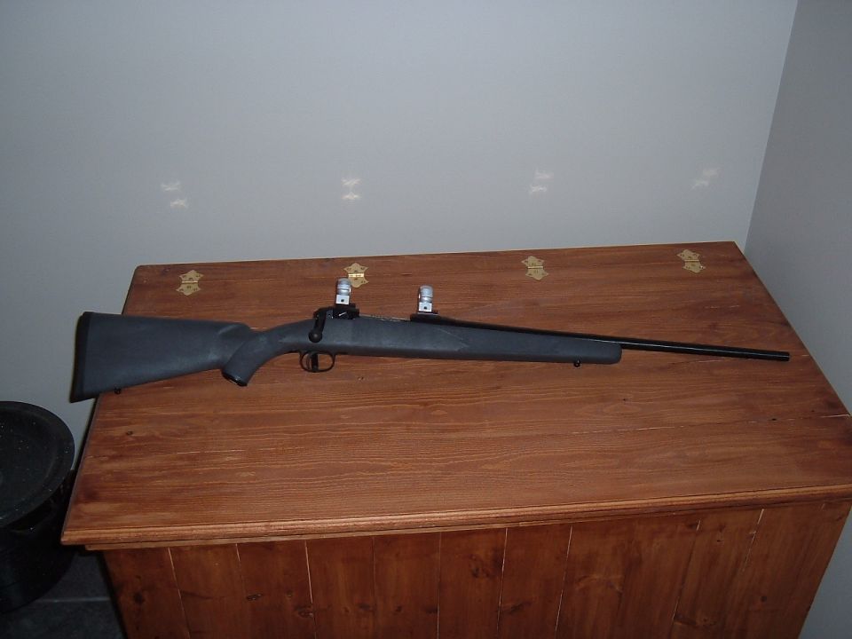 Rifle on wooden chest