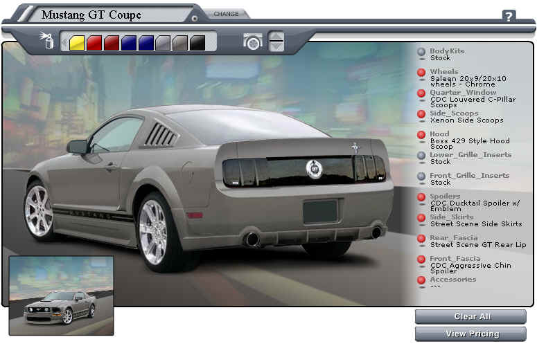 Gray 2005 Ford Mustang GT Coupe rear 3/4 view with custom spoilers and side skirts