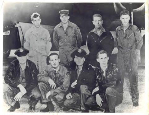 2003 Jeep TJ - Nine men in flight suits and uniforms pose for a photograph in front of an aircraft.