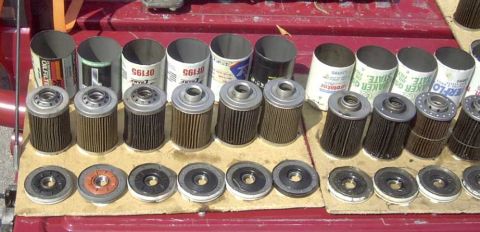 1997 Ford Taurus - A variety of oil filters are displayed, some still in their packaging cans.