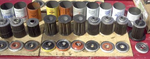 1997 Ford Taurus - Various oil filters and their associated parts are displayed, some with visible brand names.