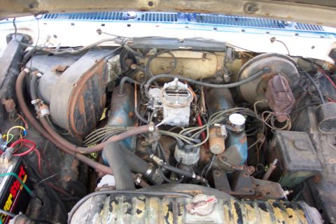 1975 Ford F-150 - Close-up view of a vehicle's engine bay, showing various components and wiring.