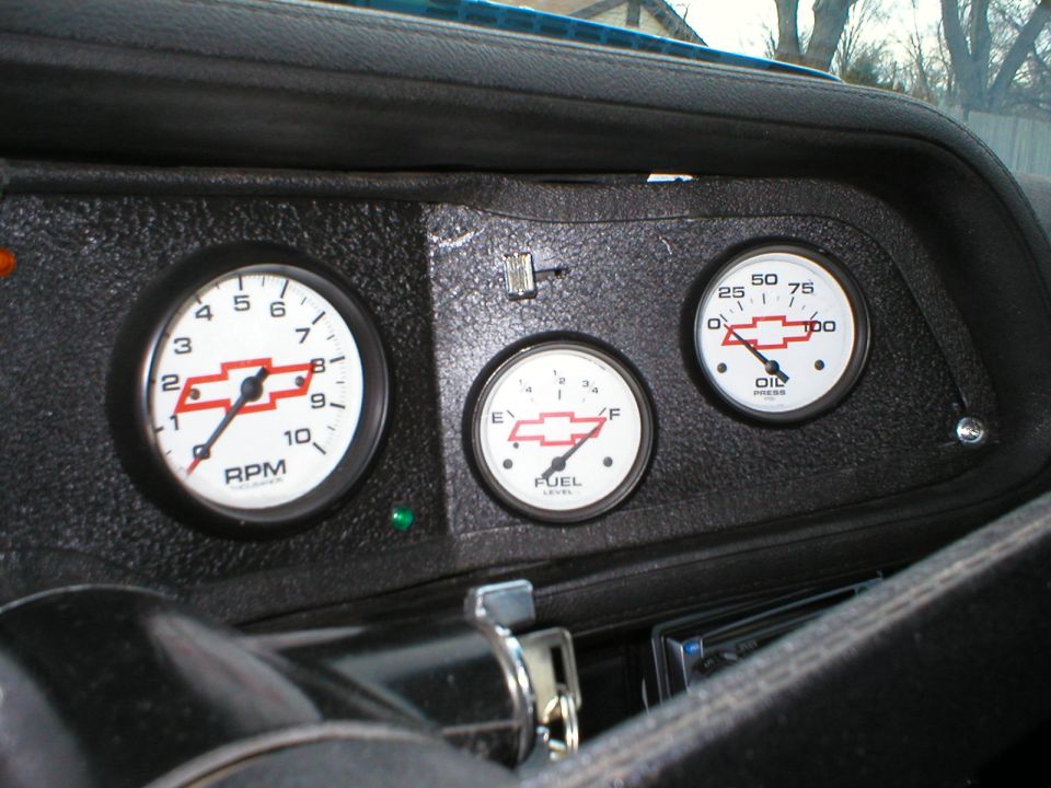 1970 Chevrolet Camaro dashboard with RPM, Fuel, and Oil gauges, all Chevrolet bowtie emblems