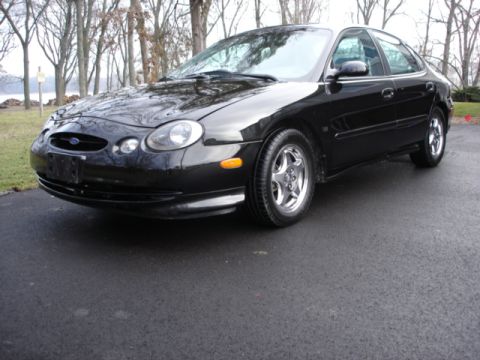 1998 Ford Taurus - This black 1998 Ford Taurus is shown from a 3/4 front angle.