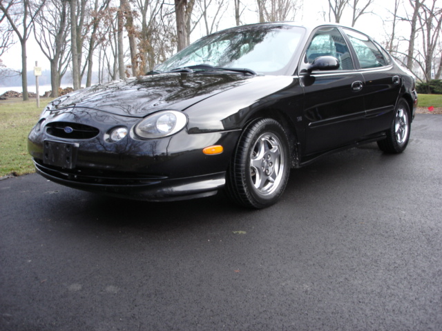 Black 1998 Ford Taurus sedan, 3/4 front view