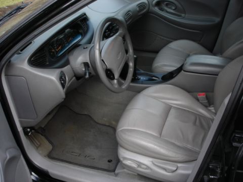 1998 Ford Taurus - Interior view of a 1998 Ford Taurus SHO, highlighting the gray leather seats and dashboard.