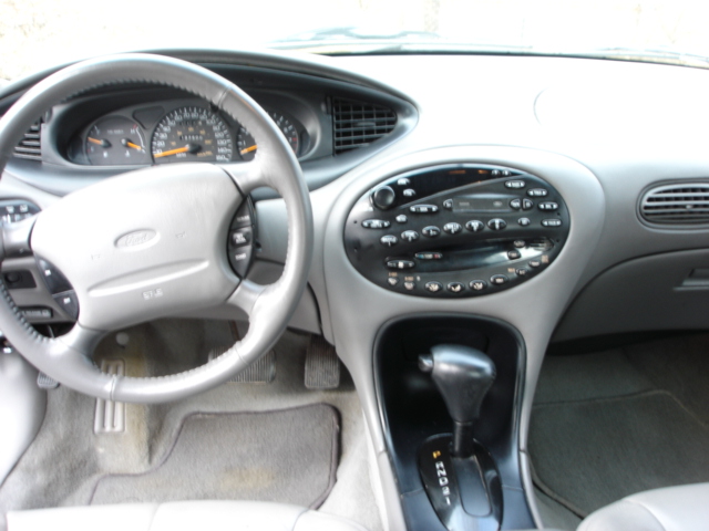 Gray 1998 Ford Taurus interior showing dashboard, steering wheel, and center console