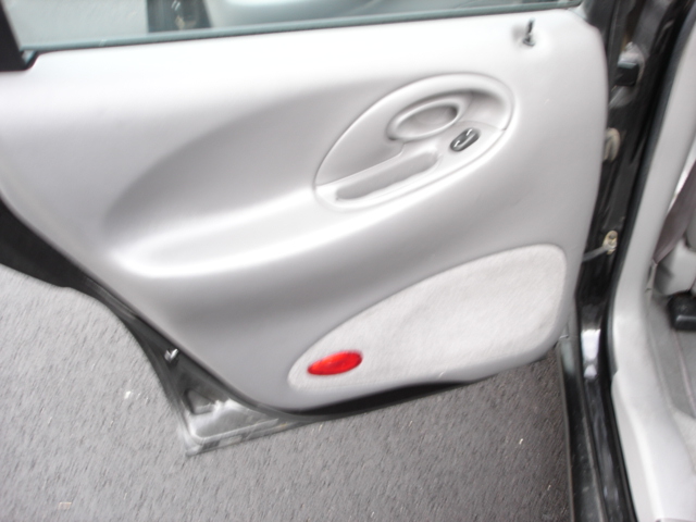 Interior door panel with window control and red reflector