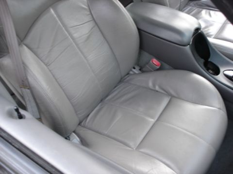 1998 Ford Taurus - Interior view of a gray leather car seat and center console, with a watermark at the bottom right.