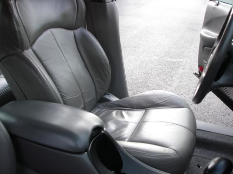 1998 Ford Taurus - Close-up of the interior, focusing on the driver's seat and center console.