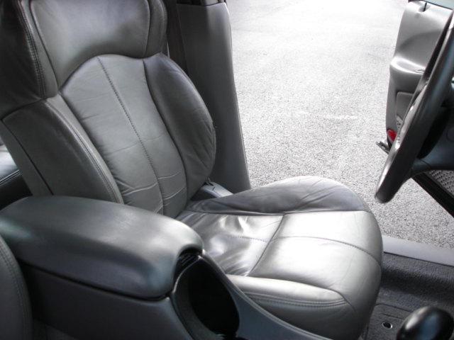 Interior view of gray leather seats and center console