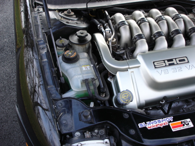 1998 Ford Taurus SHO V8 32V engine bay with coolant reservoir and intake manifold