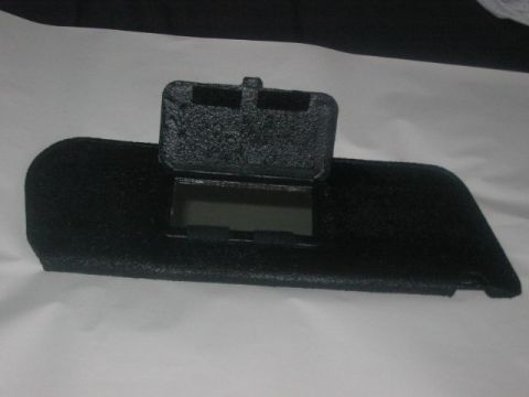 1991 Ford Bronco - This black dashboard component features a flip-up cover revealing a mirrored compartment.