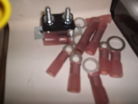 1981 Ford Bronco - A collection of automotive electrical terminals and a fuse holder are shown.