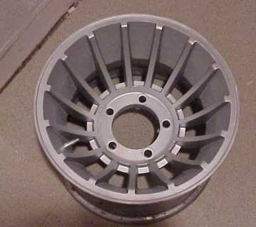 1976 Jeep CJ7 - Close-up of an aluminum alloy wheel, a multi-spoke design.