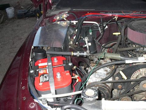 2001 Dodge 1500 - Custom aluminum panel installed in the engine bay next to the battery and air intake.