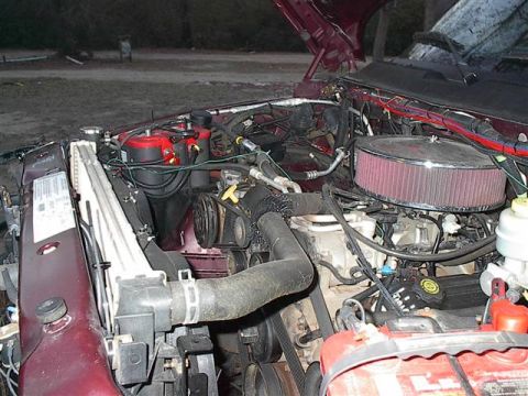2001 Dodge 1500 - The engine bay of a 2001 Dodge 1500 shows various components and wiring with the hood open.