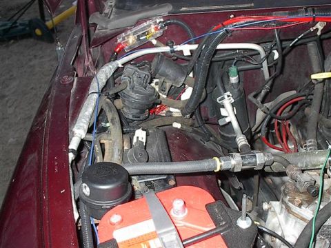 2001 Dodge 1500 - Close-up view of the engine bay, highlighting custom wiring and a fuse box installation.