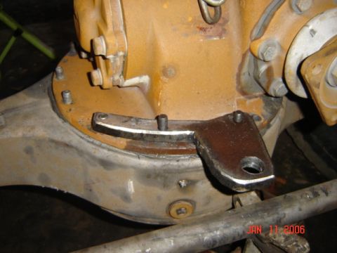 1982 Nissan Titan - Close-up of a differential housing with a metal bracket attached. Watermark reads 'Supermotors.net'.