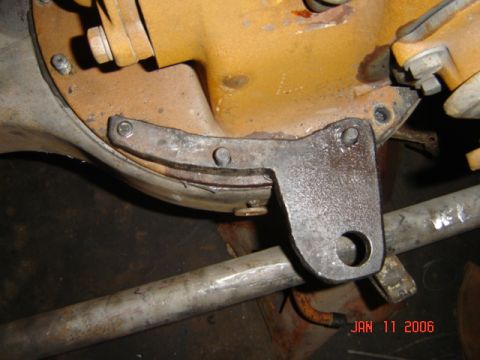 1982 Nissan Titan - This image shows a close-up of a vehicle's differential housing and a part of its suspension system.