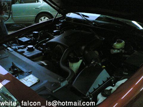 1999 Mercury Grand Marquis - The hood is open, revealing the engine compartment and various components.