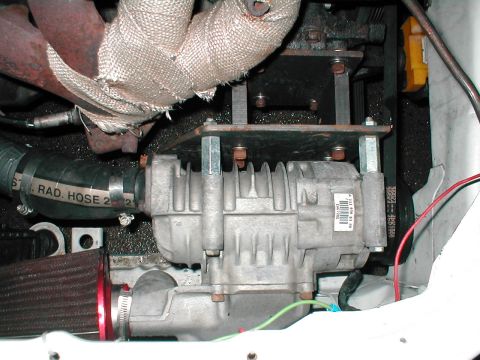 1992 Ford Probe - A close-up view shows a component within the engine bay, hoses and belts.