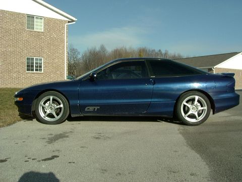 1995 Ford Probe - Side profile of a blue 1995 Ford Probe GT with aftermarket wheels.