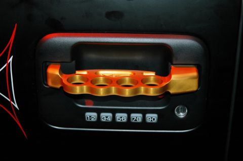 1991 Ford Taurus - Custom door handle a brass knuckle grip and a numeric keypad for access.