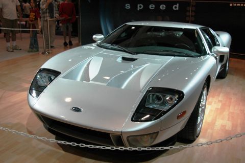 1991 Ford Taurus - Front view of a silver sports car on display indoors.