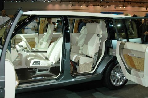 1991 Ford Taurus - Interior view of a concept SUV with multiple rows of seats and open doors.