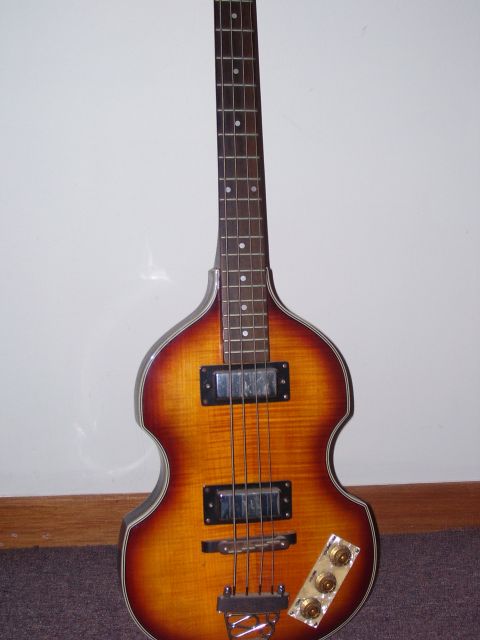 1984 Ford Bronco - This is a violin-shaped electric bass guitar with a sunburst finish.