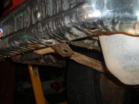 1985 Ford Bronco II - Underside view of a vehicle's fuel tank and suspension parts.