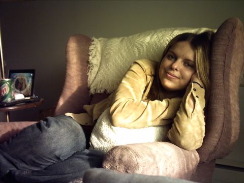 1995 Ford Probe - Woman relaxing in a chair with a can of Mountain Dew and a framed photo on a side table.