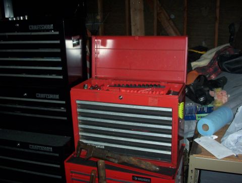 1993 Ford Bronco - Red and black toolboxes are shown in a workshop setting with various tools.