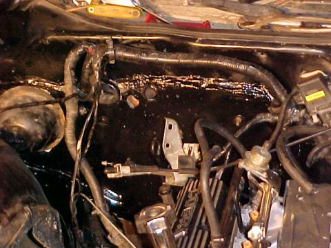 1973 Ford Ranchero - Close-up view of the engine bay, showing various hoses and electrical wiring.