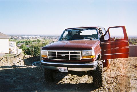 1992 Ford Bronco - This Ford truck is parked on a construction site with a suburban neighborhood in the background.