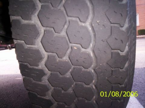1988 Ford Bronco - Close-up of a tire tread with a date stamp and website visible.