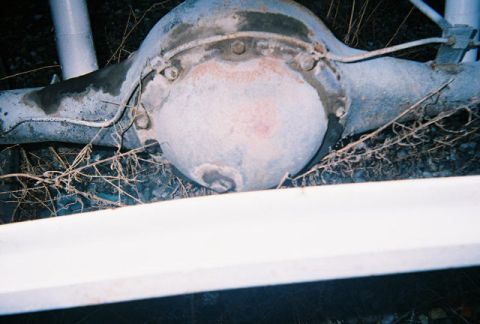 1992 Ford Bronco - This is a close-up view of a vehicle's rear axle differential, showing signs of wear and tear.