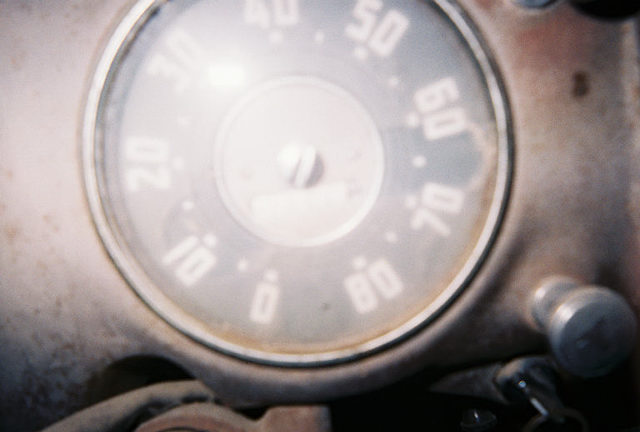 Close-up of a vehicle's speedometer, showing numbers like 10, 20, 30, 40, 50, 60, 70, 80